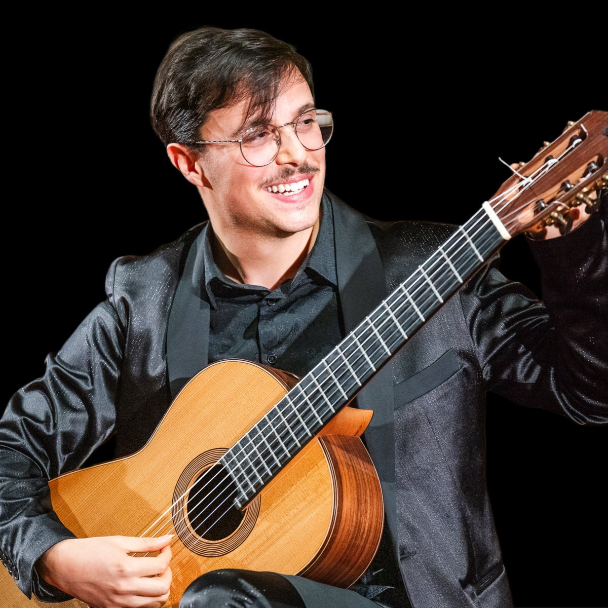 Nino D’Amico playing classical guitar